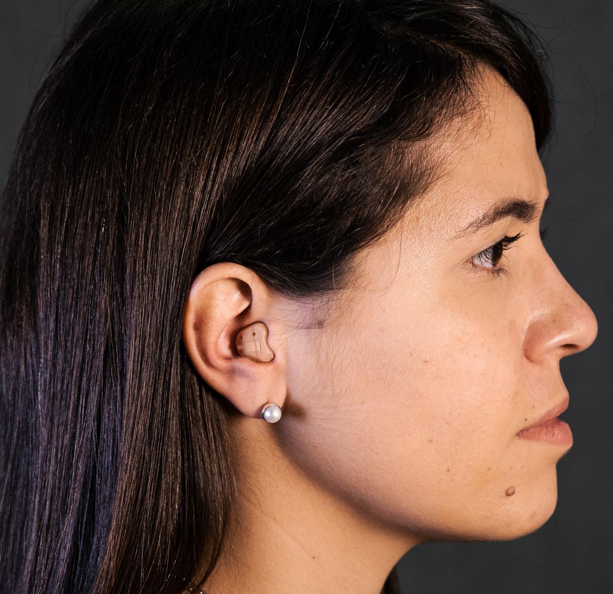 Woman wearing a In-the-Canal (ITC) style hearing aid