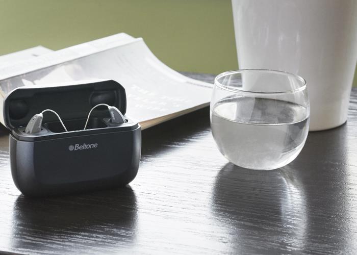 Hearing aids charger on bed table