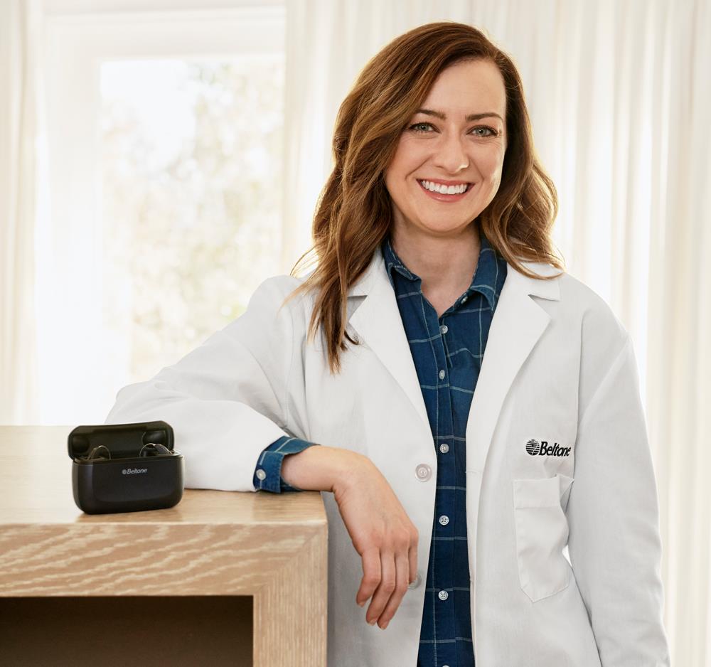 Beltone hearing care professional with Beltone Amaze hearing aid