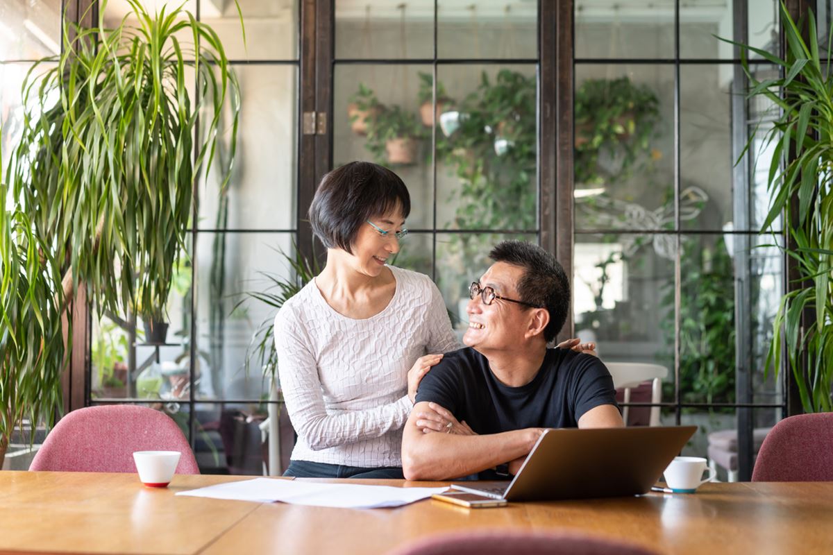 Couple relaxing and watching the sunset.