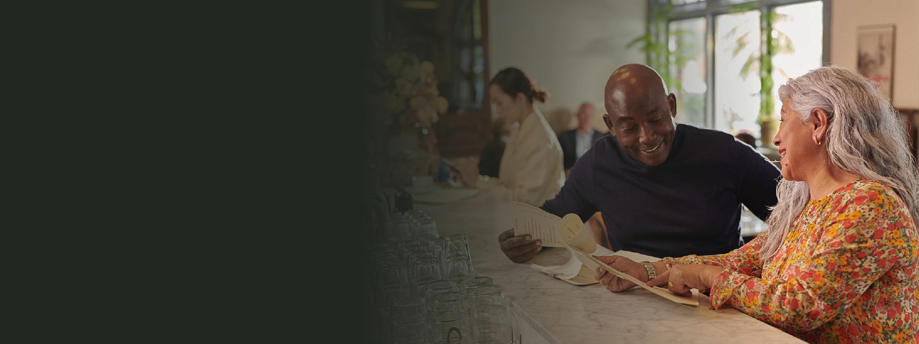 Woman and man talking at a café