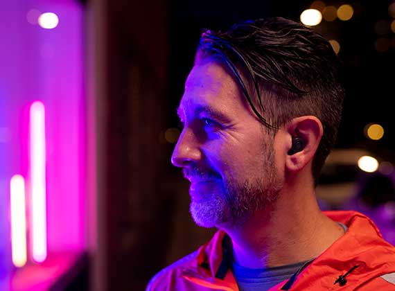 Man outside with ReSound ONE custom hearing aids in the ear