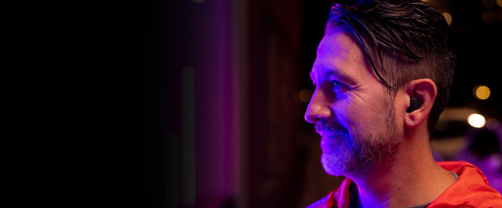 Man outside with ReSound ONE custom hearing aids in the ear